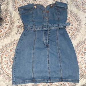 A Jean dress, strapless that buttons up in the front and have a belt to it.